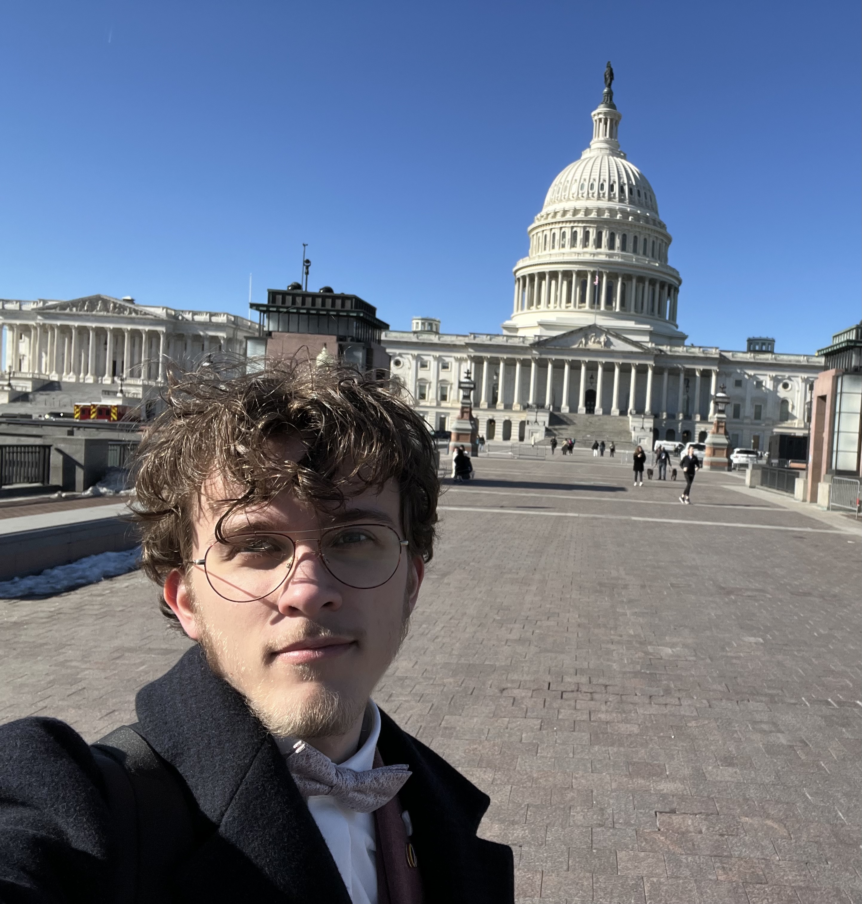 A portrait in front of the United States Capitol